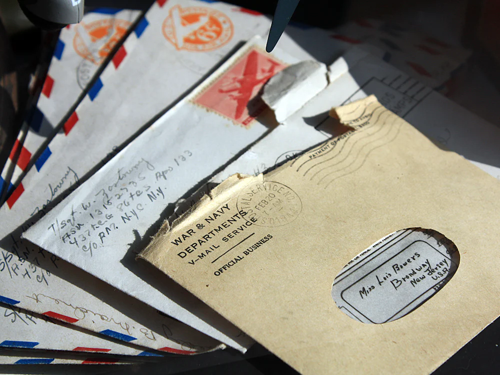 A fan of vintage airmail envelopes with postmarks and handwritten addresses