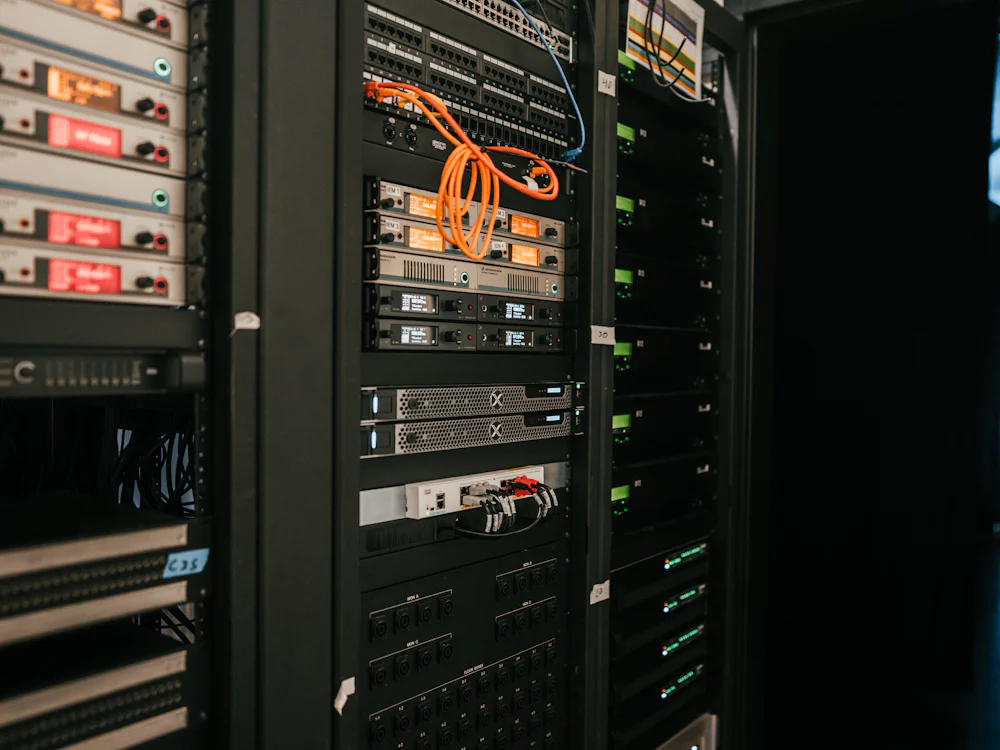 Network and server equipment mounted in a rack, patch cables running between units